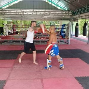 Honour Muay Thai, Krabi - Ajarn Lai and his student getting to grips with elbowing