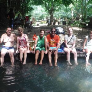 backpackers getting fish spa