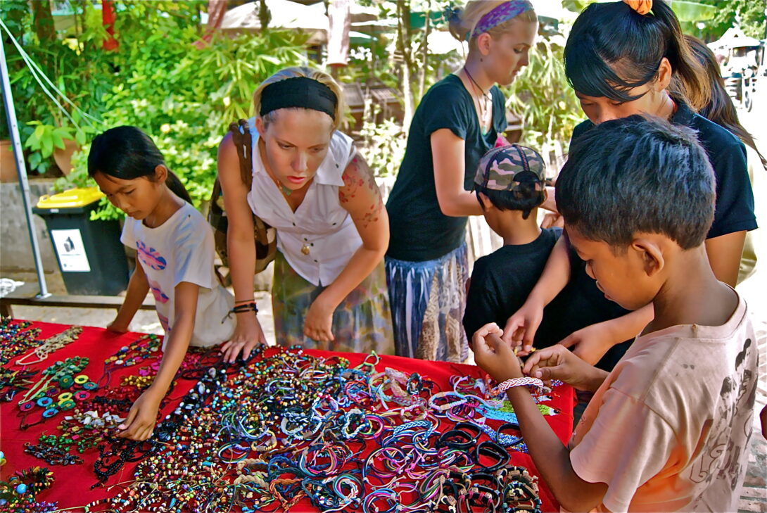 Shopping for bracelets at the market in Luang Prabang, Laos.