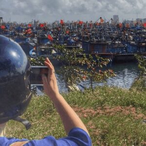 A Girl Takes a Photo of her View on The Hai Van Pass