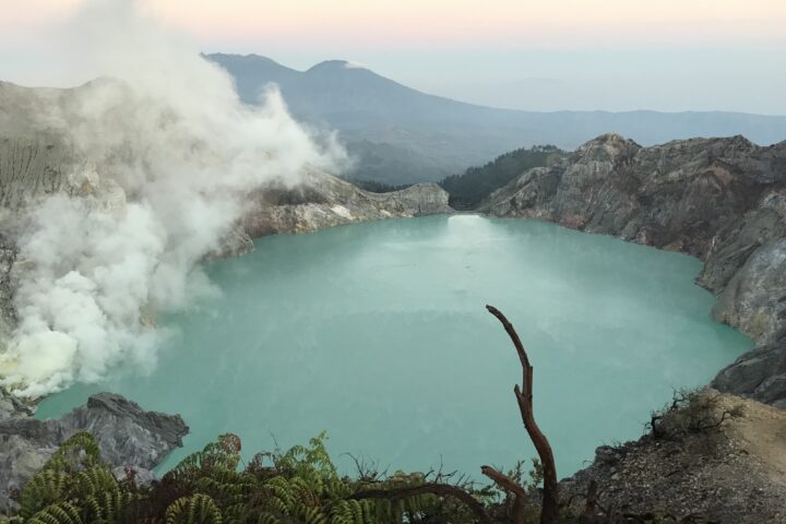 Bright blue lake in volcano crater